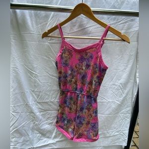 Short pink romper with flower detail